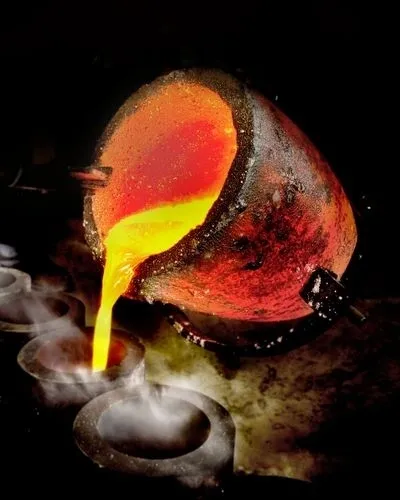 Molten metal pouring from crucible