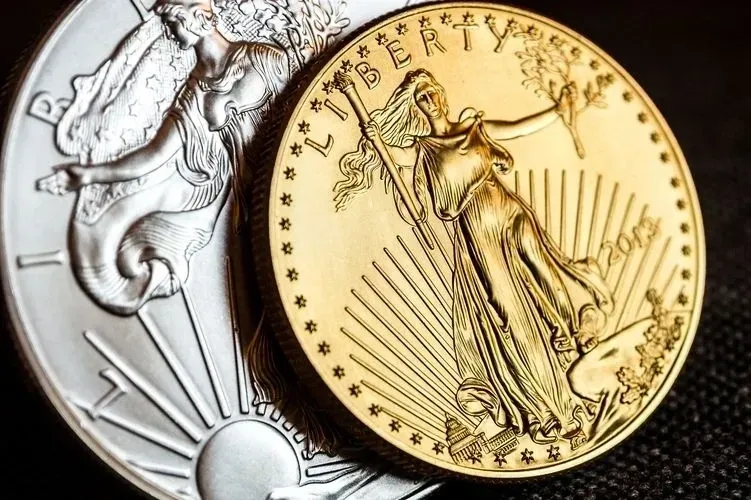 Shiny collectible coins on dark background