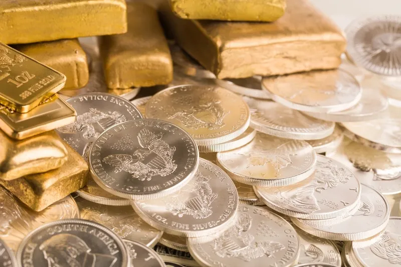 Gold bars and silver coins